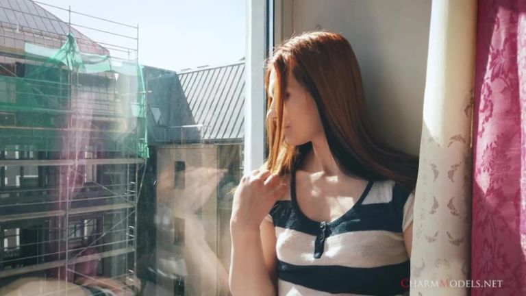 Lea in Sunshine Redhead Babe at the Window